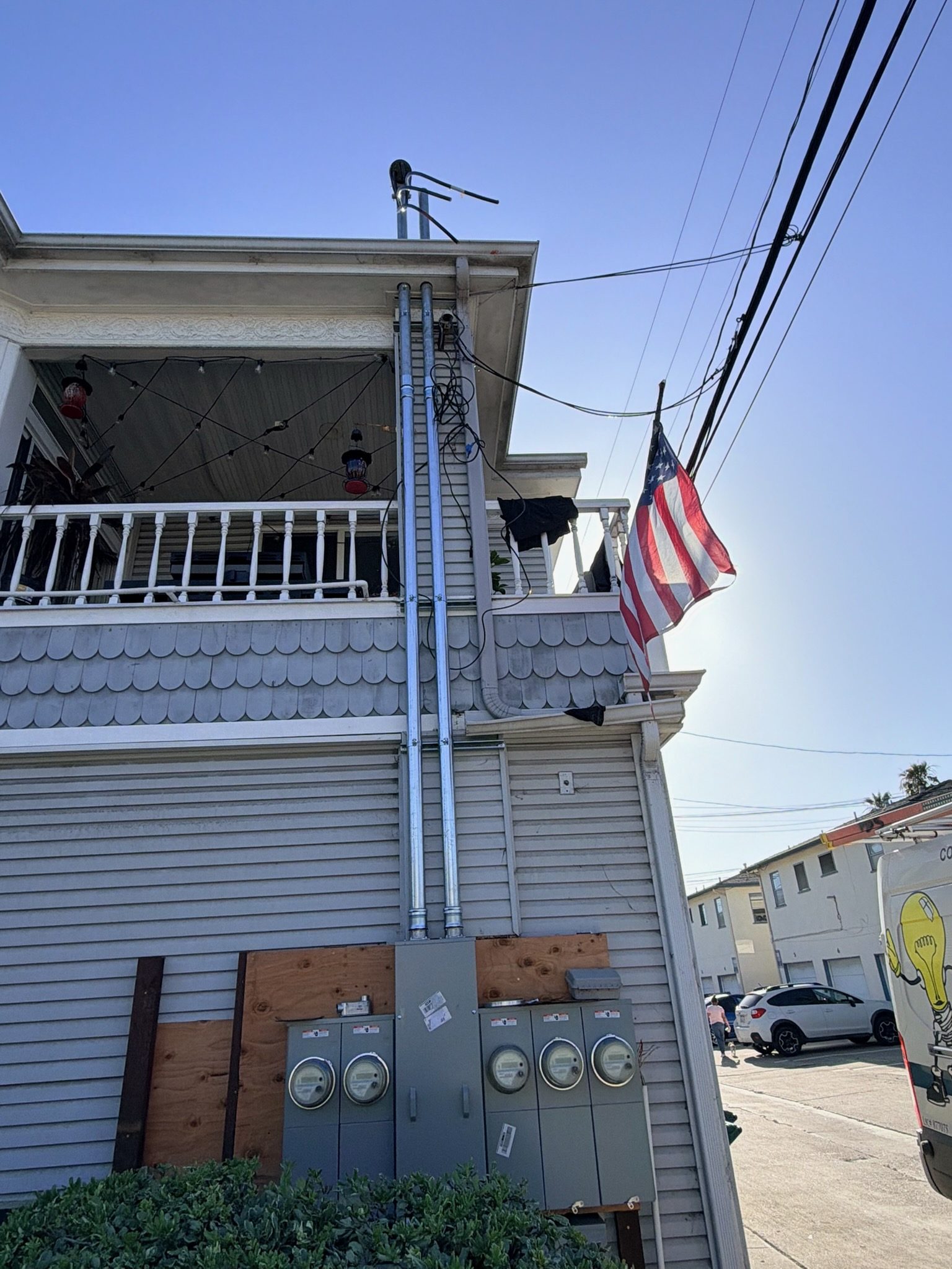 CLD Electric truck at a San Diego residence with American flag, service upgrade in progress
